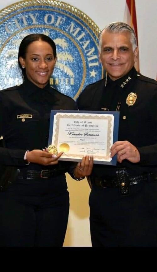 Keandra Simmons with retired Miami Police Chief Jorge Colina.